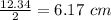 \frac{12.34}{2}=6.17\ cm