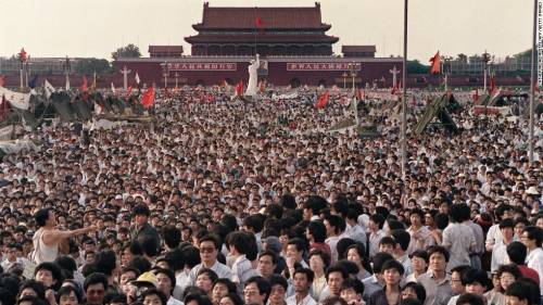 What inspired protesters to demonstrate at tiananmen sqaure
