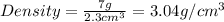 Density=\frac{7g}{2.3cm^3}=3.04g/cm^3