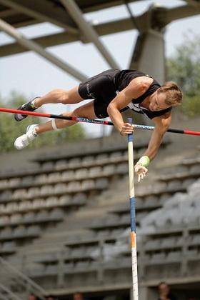 Apole vaulter runs forward, plants his pole, rises in the air and lands. what point represents his g