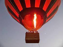 Explain why a propane torch is lit inside a hot air balloon during preflight preparations. which gas