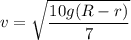 v=\sqrt{\dfrac{10g(R-r)}{7}}