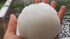 Which of the following best describes hail?  a- small ice pellets that may fall to the ground in a m