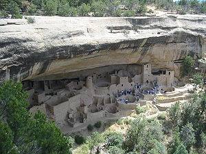 Which culture engaged in trade and built large cliff dwellings?