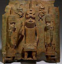 Read the excerpt from "benin plaque: the oba with europeans.” his neck is completely in