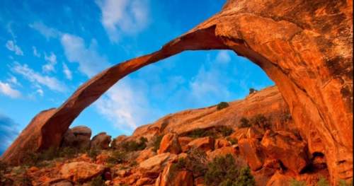 This natural arch was produced by:  a. heavy exposure to running water at the base of the roc