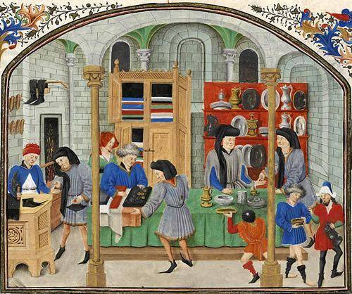 The image shows the interaction of merchants and buyers in a shop located on the side of a medieval