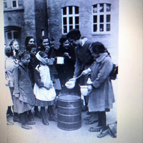 The photograph shows children in germany after wwii.  q: the photograph was most likely taken