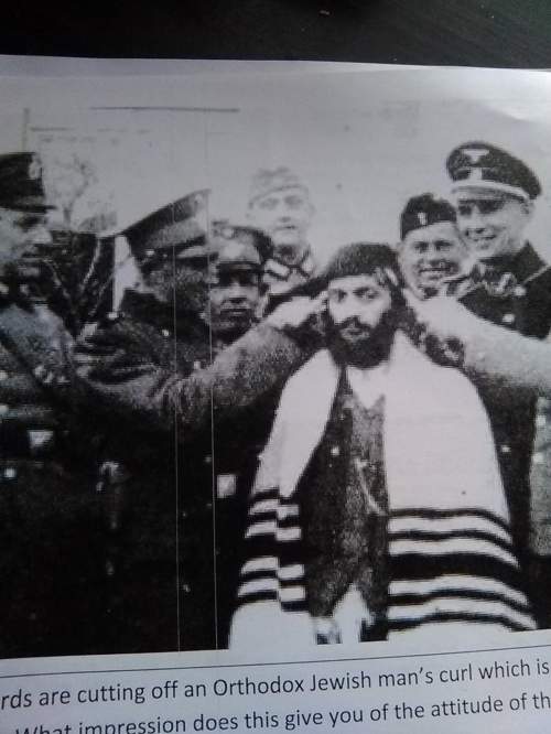 These ss guards are cutting off an orthodox jewish man's curl which is part of his religious beliefs