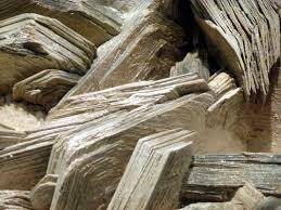 Mica and feldspar are chemically weathered into:  sand grains clay minerals limestone calcium carbon