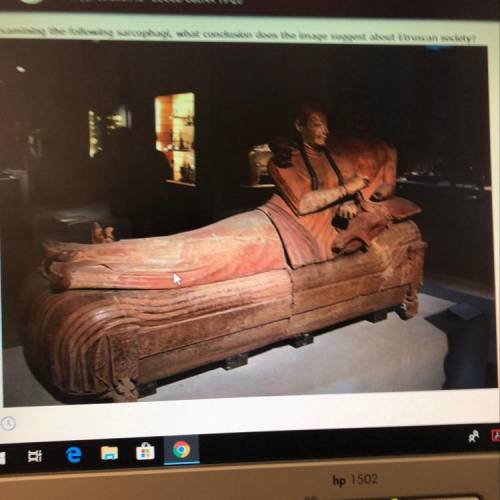 Examining the following sarcophagi, what conclusion does the image suggest about Etruscan society?