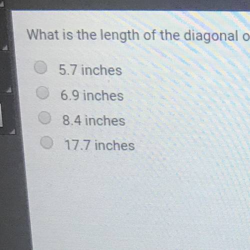 What is the length of the diagonal of a cube with a side length of 4 inches? Round to the nearest te