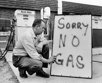 Signs for gas such as the one in this photograph resulted from — * A. an embargo by the Organization