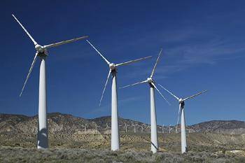 The image below shows a group of wind turbines, which can be used to produce electrical energy.

S