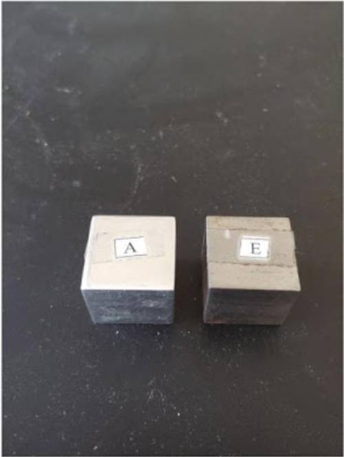 You are observing two metal cubes that have the same shape and size. However cube E is significantl