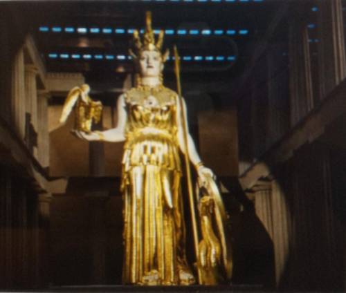 This is a golden statue of the goddess Athena What detail of the statue suggests that the Greeks va