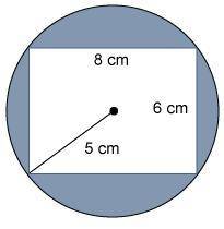 A rectangle is inside a circle with a 5 cm radius.

What is the area of the shaded region?
Use 3.1