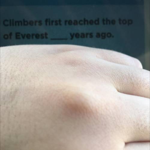 How many years ago was when the first climber reached the top of everest