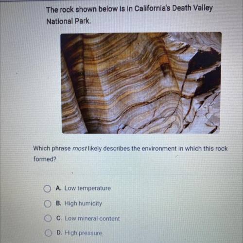 The rock shown below is in California's Death Valley

National Park.
Which phrase most likely desc