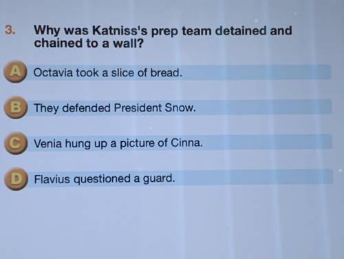 Why was katniss's prep team detained and chained to a wall