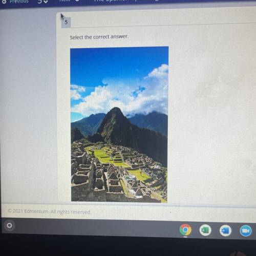 &

Identify the place shown in the picture.
OA.
Machu Picchu
OB.
La Sagrada Familia
O C.
Las I