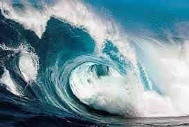 What causes waves to occur in the ocean?
