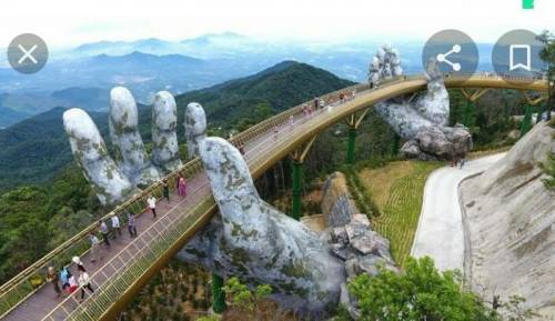 What are the dimensions of the hands that are holding the Golden Bridge (Vietnam)?